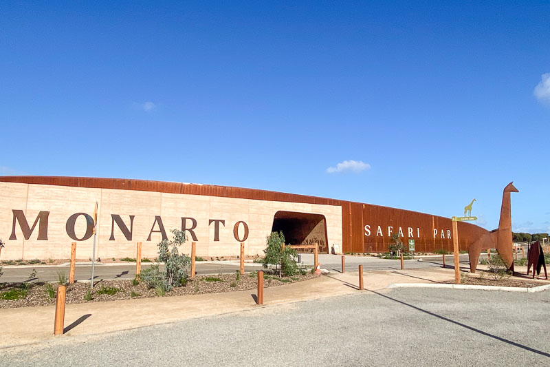 The front of a long, low building with the words 