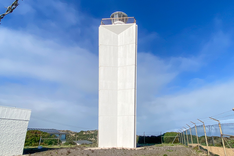 A white modern lighthouse