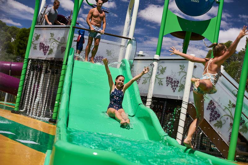 A girl sliding down a waterslide